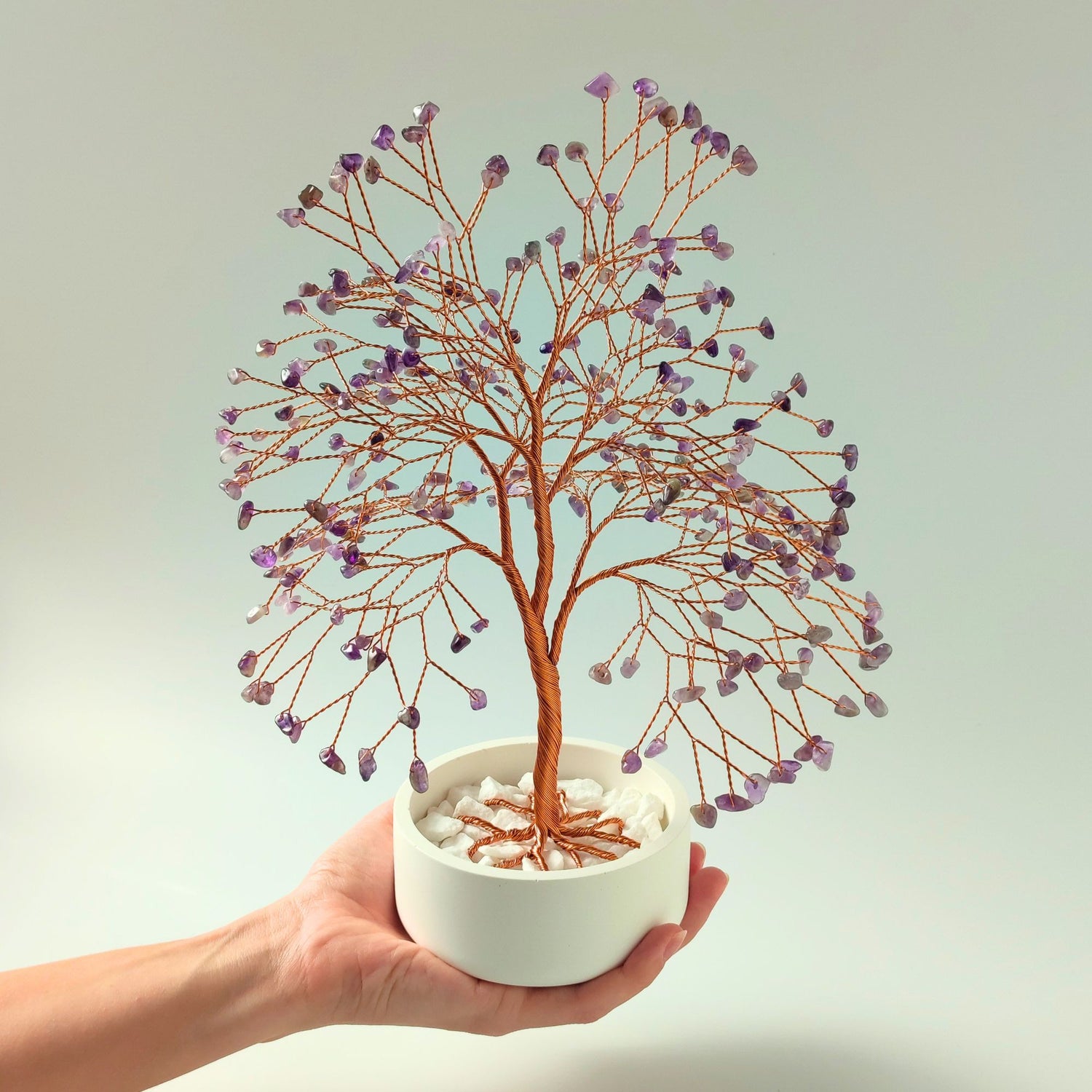 Green amethyst crystal copper large tree with decorative stones shown in hand to show size and proportion