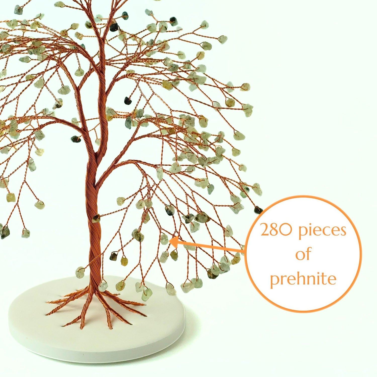 Decorative tree sculpture with prehnite stones on a white base, labeled with '280 pieces of prehnite'.