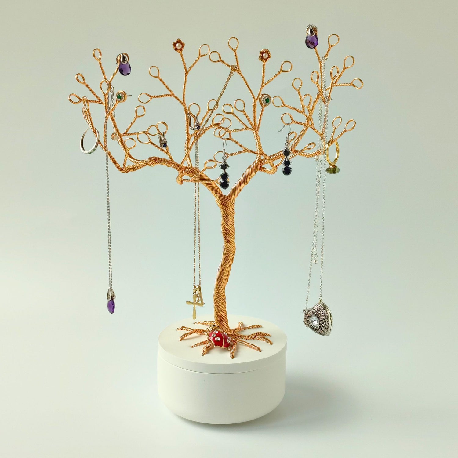 Jewelry tree with earrings on a white background