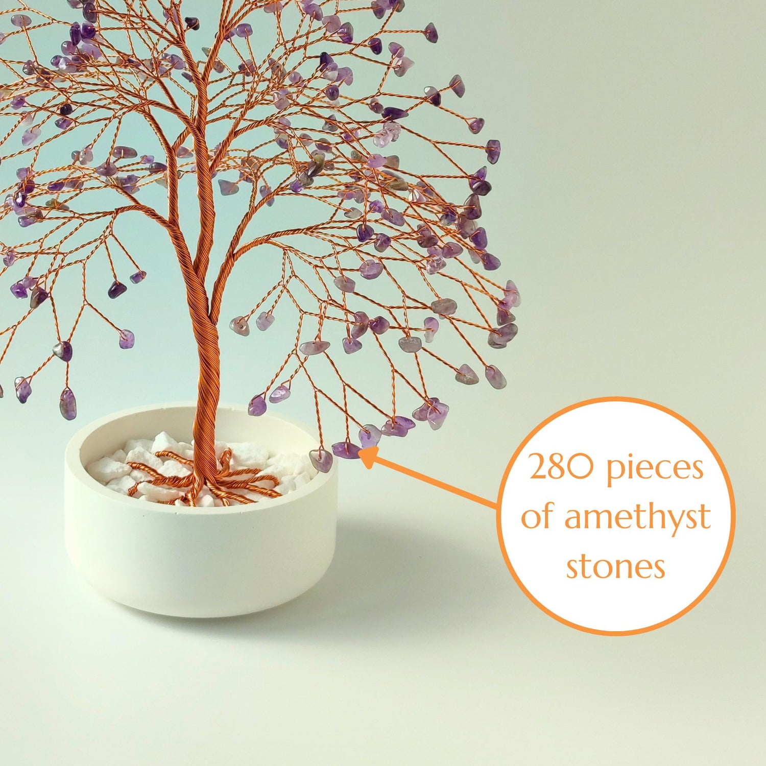 Close-up of copper wire branch with 280 natural amethyst crystal gemstone – elegant detail