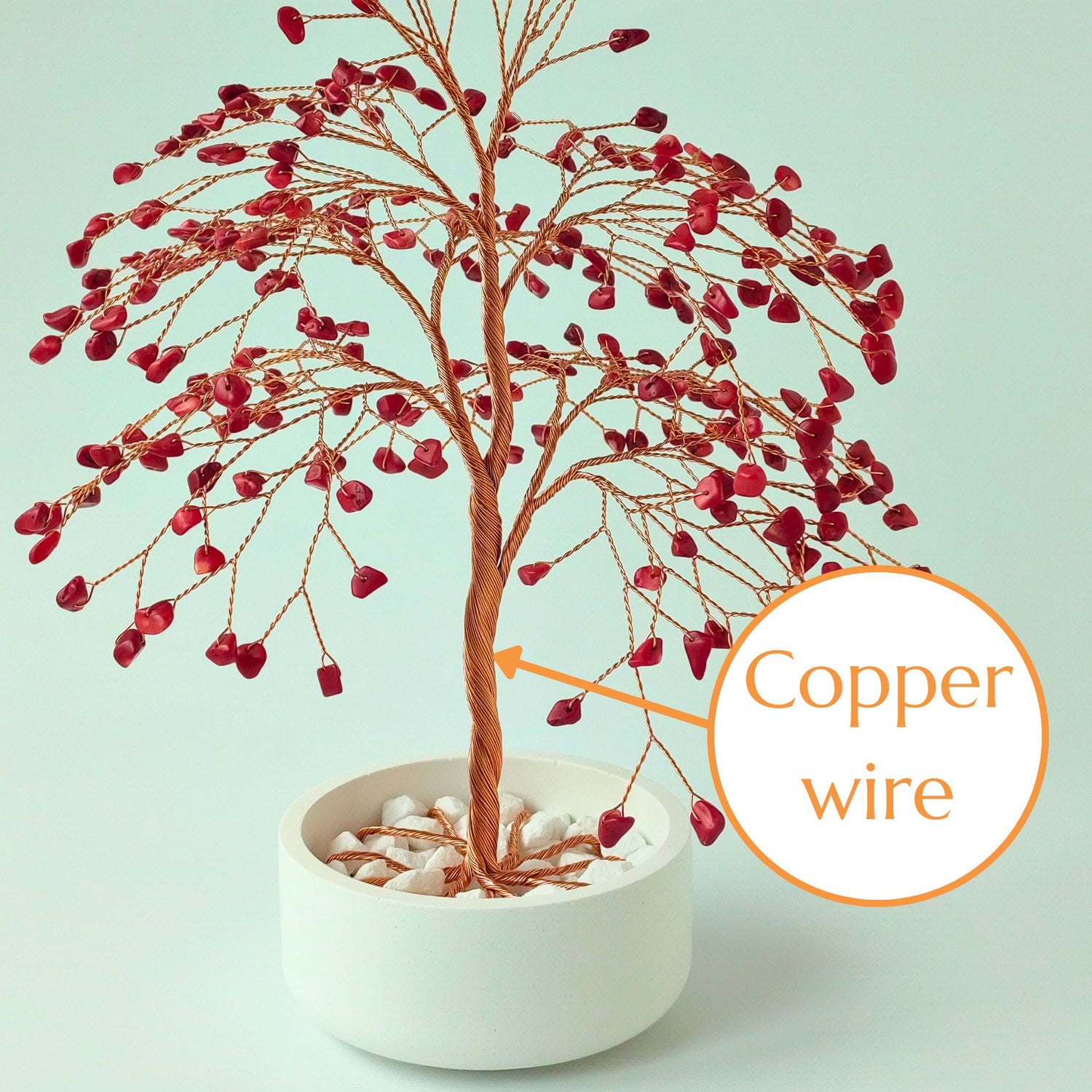Strong copper wire trunk of handmade coral gemstone large tree – close-up detail