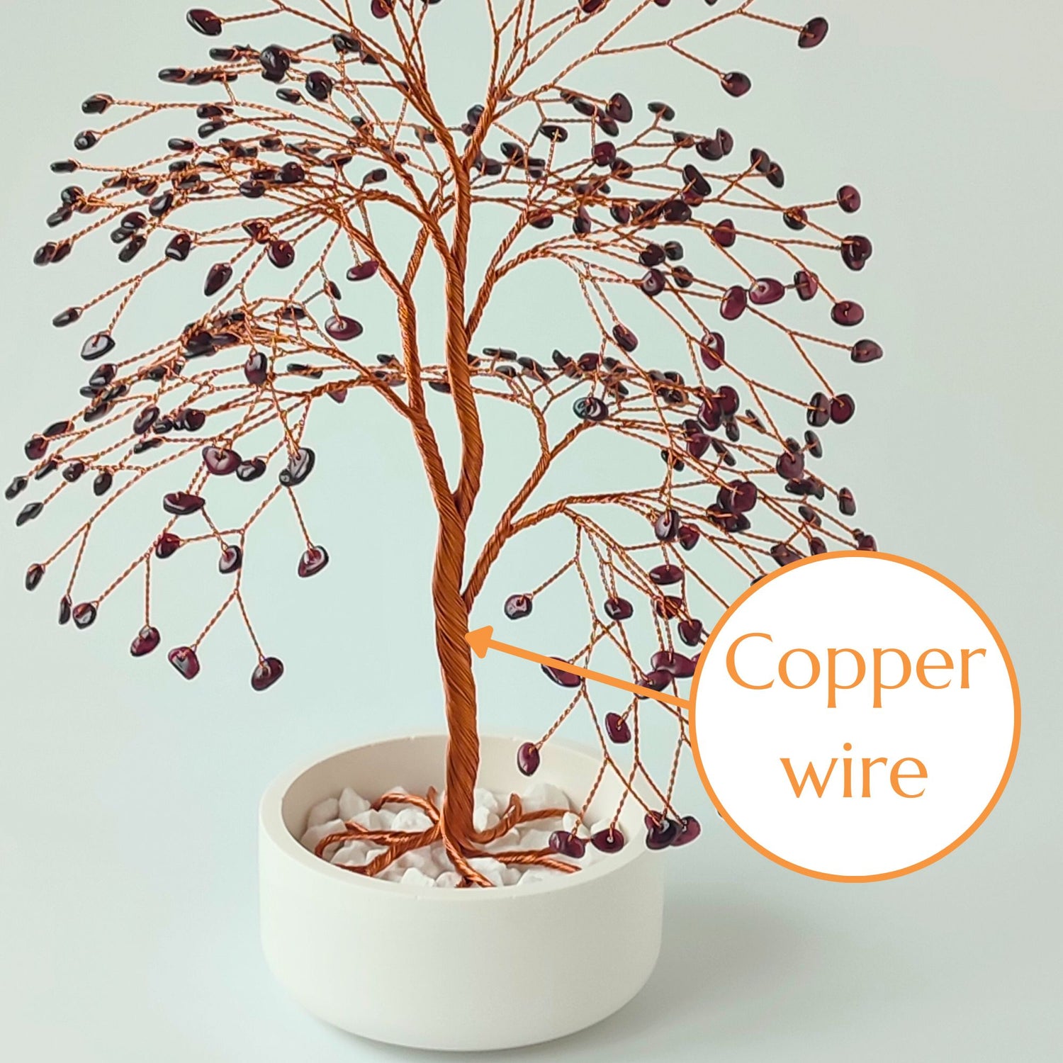 Strong copper wire trunk of handmade garnet gemstone large tree – close-up detail