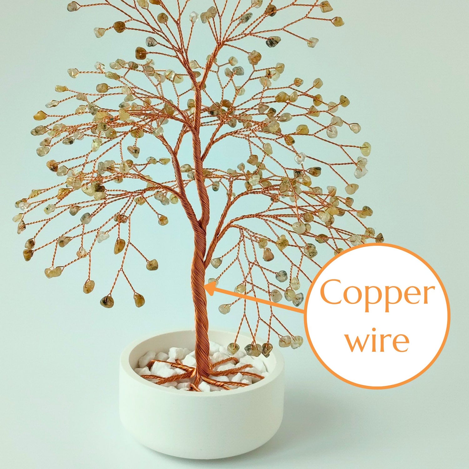 Strong copper wire trunk of handmade rutilated quartz large tree – close-up detail
