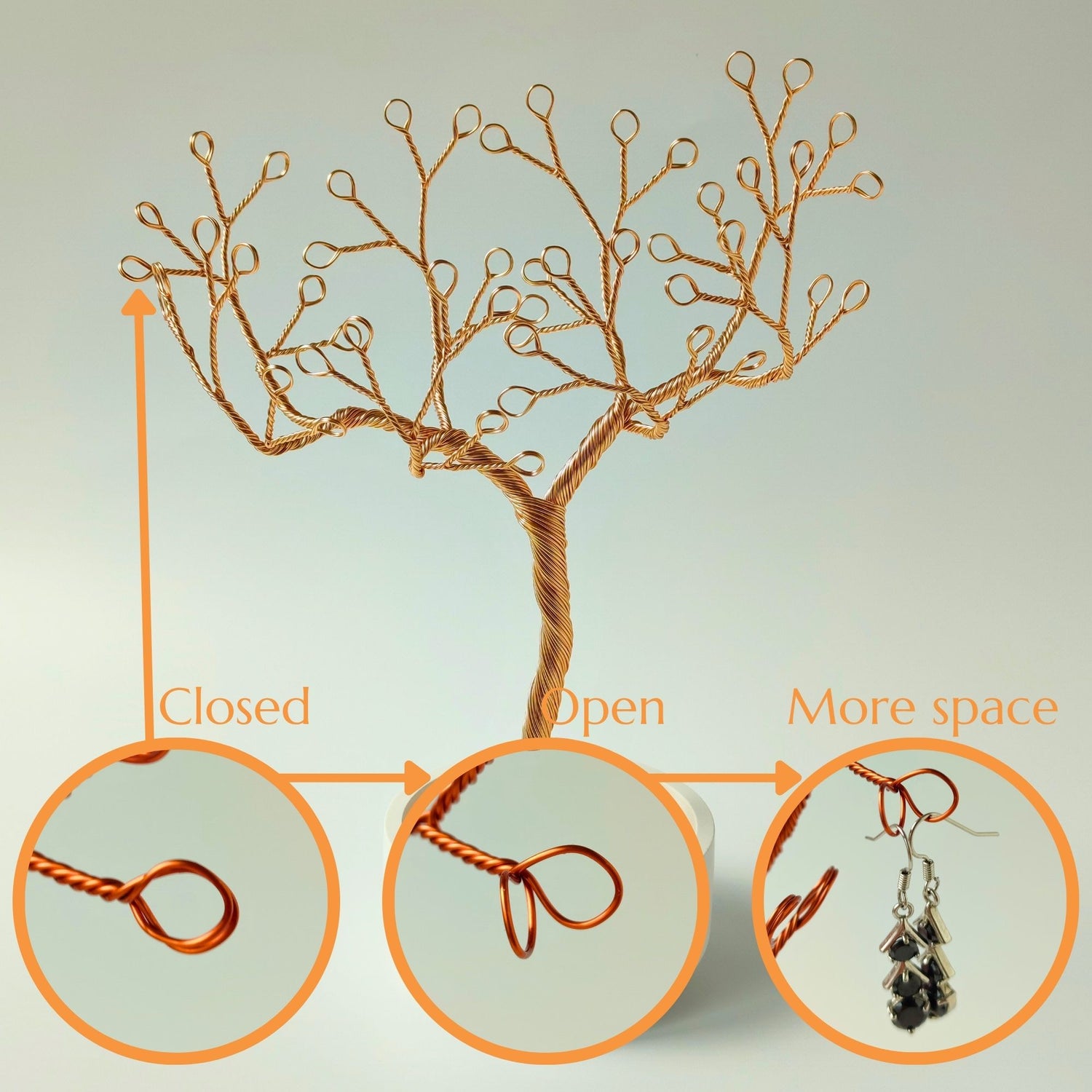 Flexible gold branches with double loops for hanging multiple pieces and tray