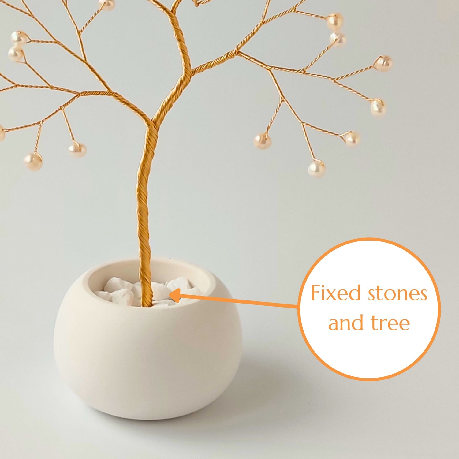 Fixed decorative stones and gold roots inside the ceramic bowl – secure base of pearl small tree