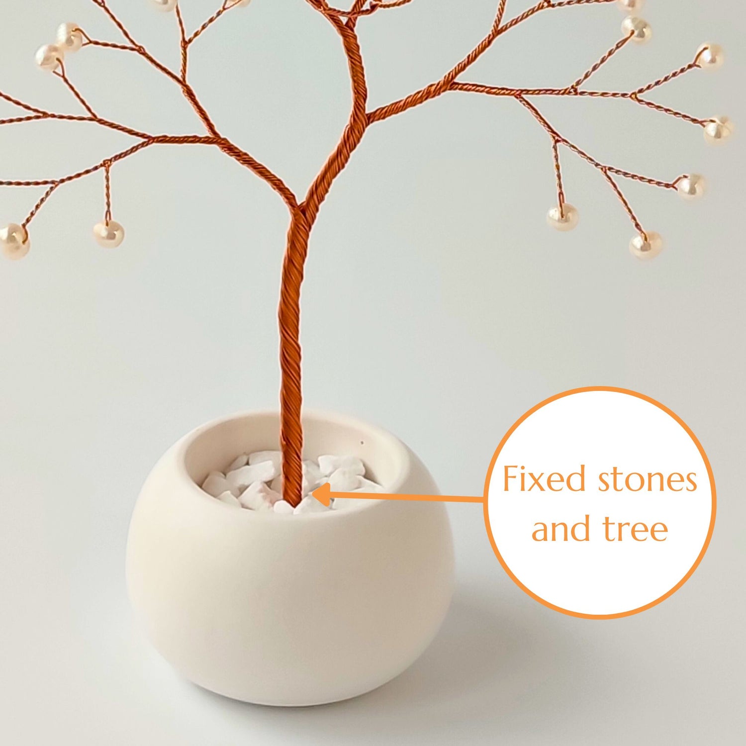 Fixed decorative stones and copper roots inside the ceramic bowl – secure base of pearl tree