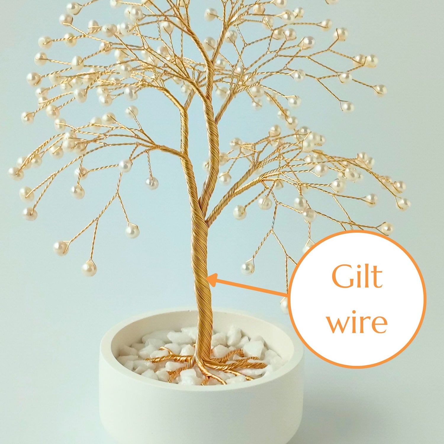 Strong gilt wire trunk of handmade pearl jewelry large tree – close-up detail