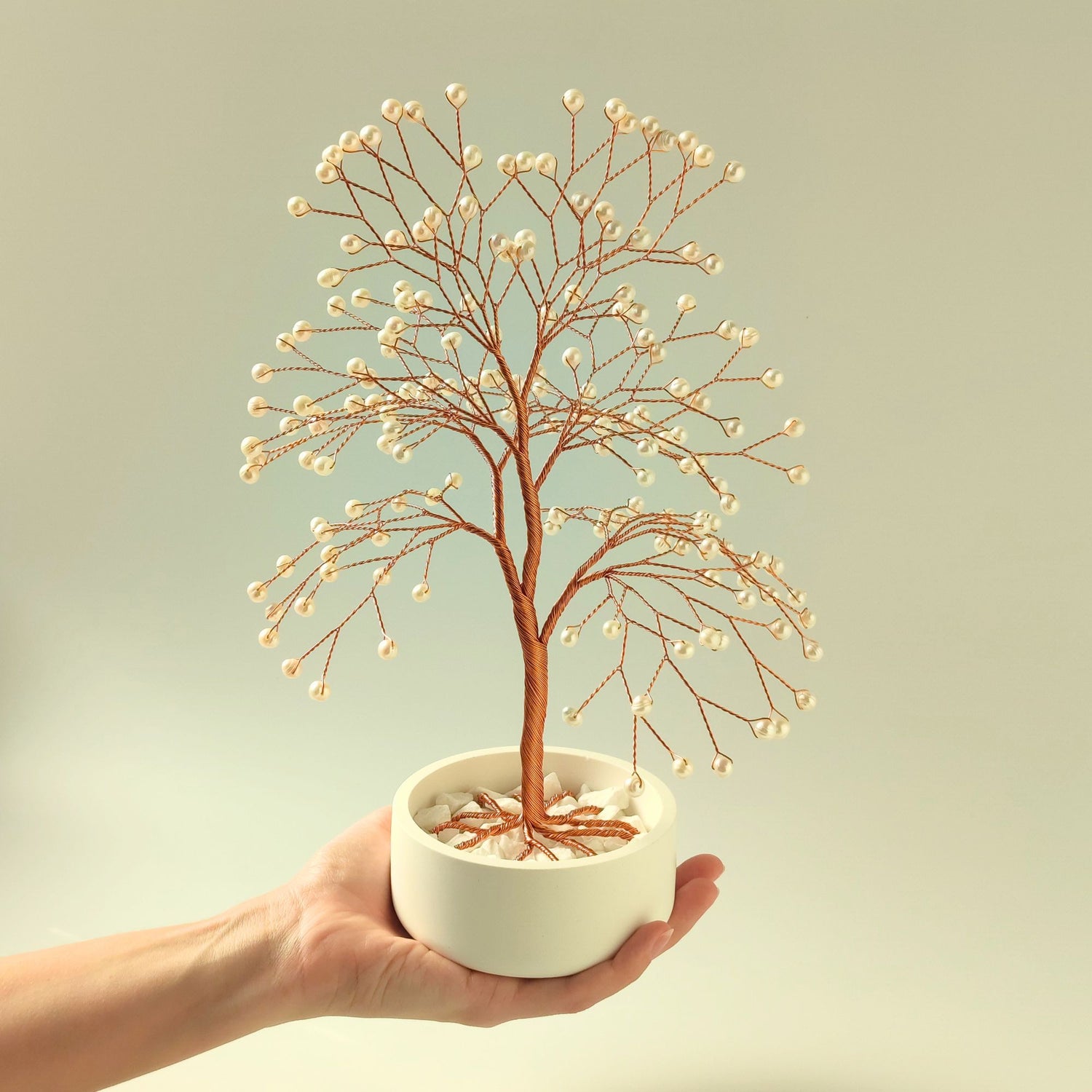 Freshwater white pearl copper large tree with decorative stones shown in hand to show size and proportion