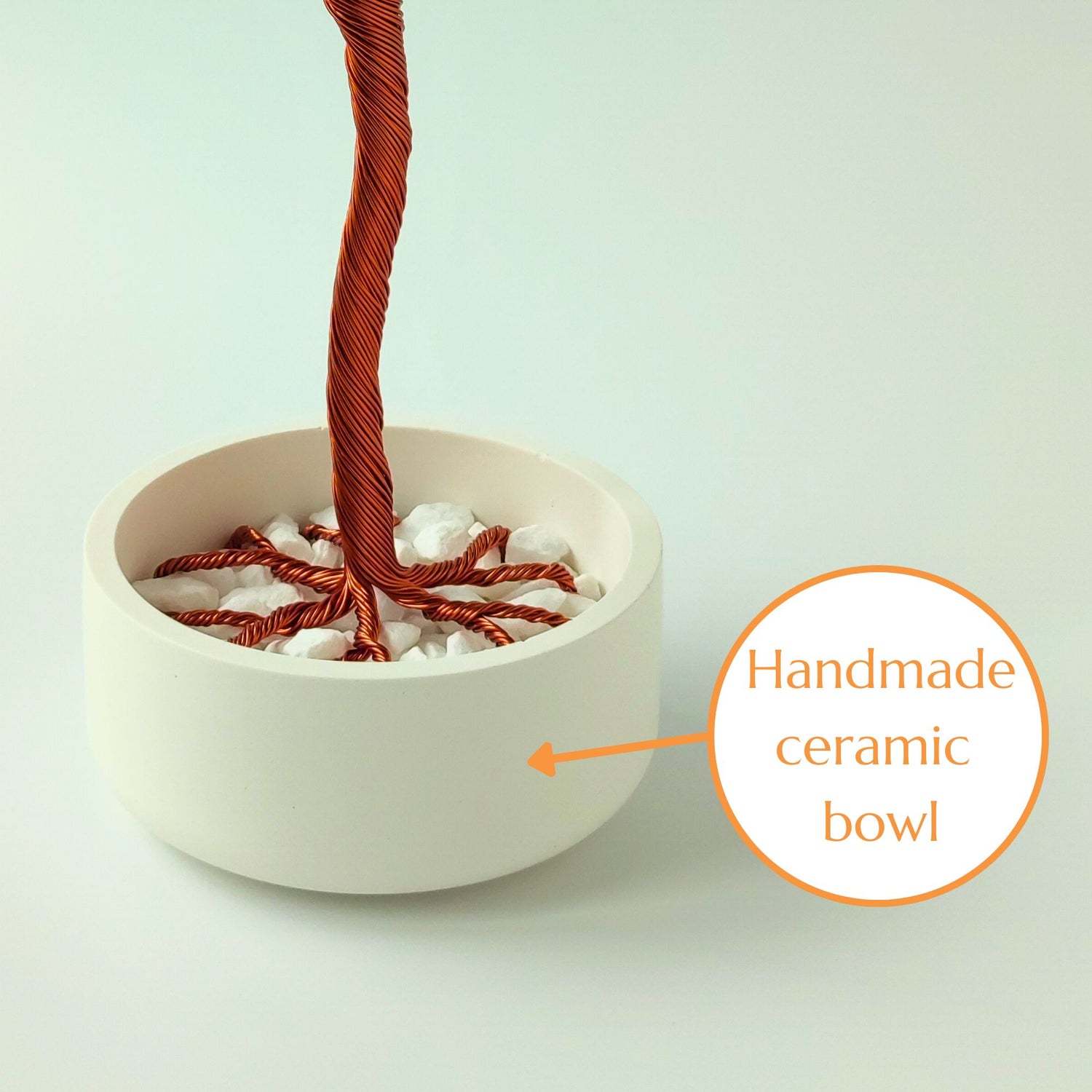 Glossy white ceramic jewelry bowl with decorative stones handmade in Transylvania