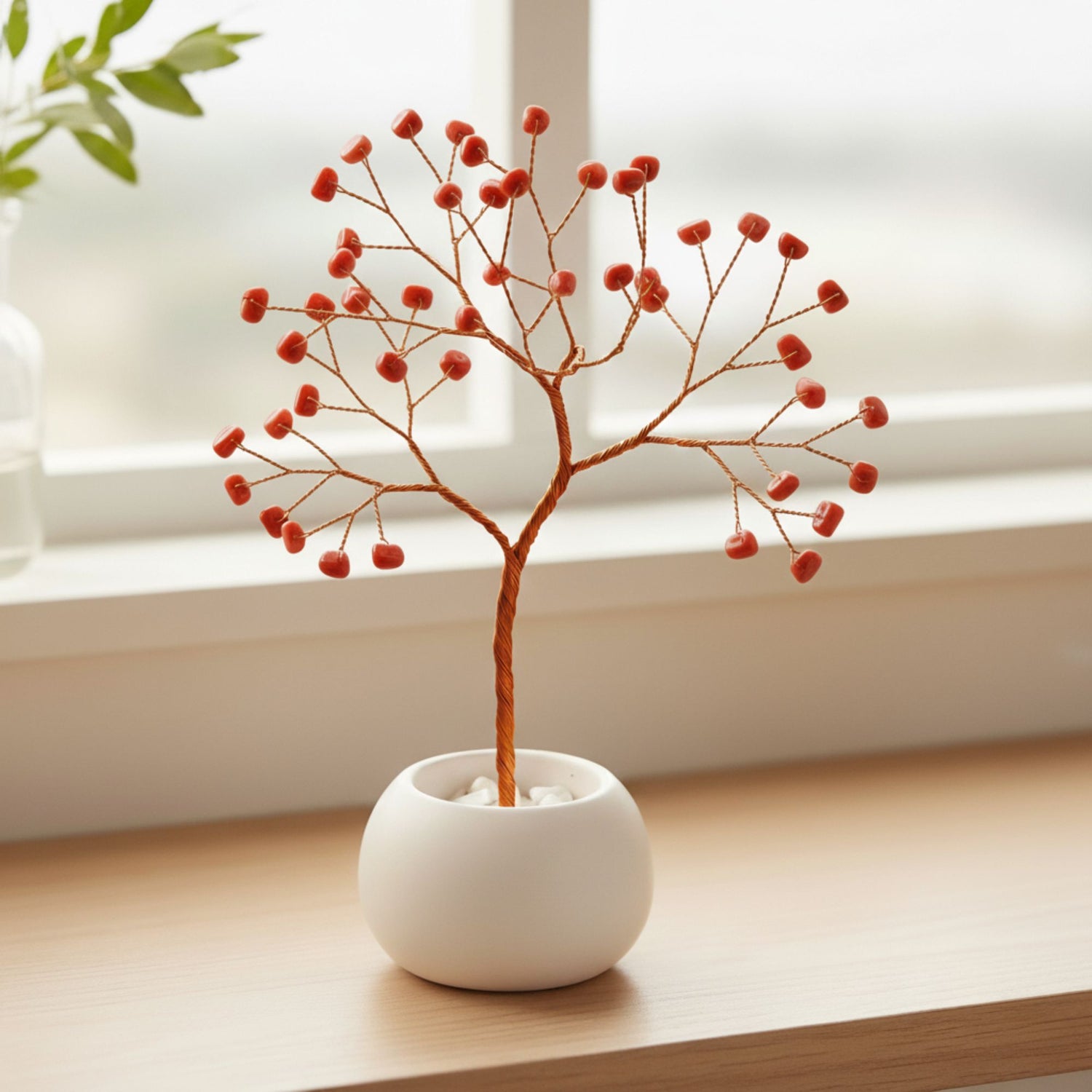 Small copper wire coral tree with red gemstone beads in ceramic bowl – handmade decorative art