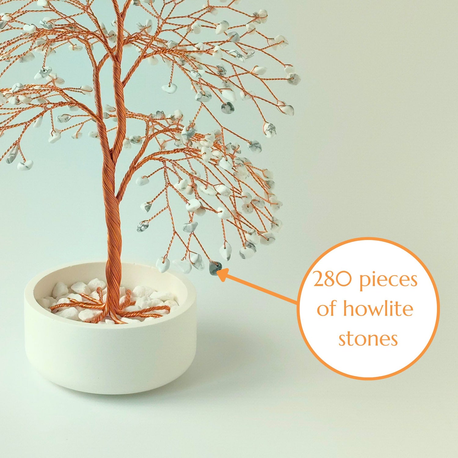 Close-up of copper wire branch with 280 natural howlite gemstone – elegant detail