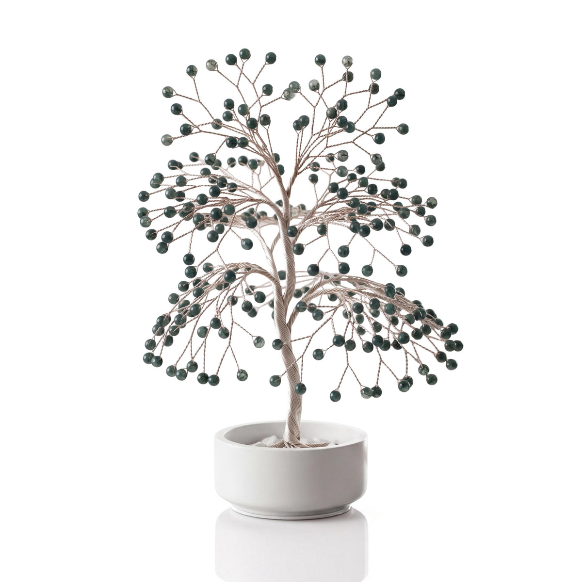 Silver-plated wire tree with polished forest green moss agate spheres in a white ceramic bowl