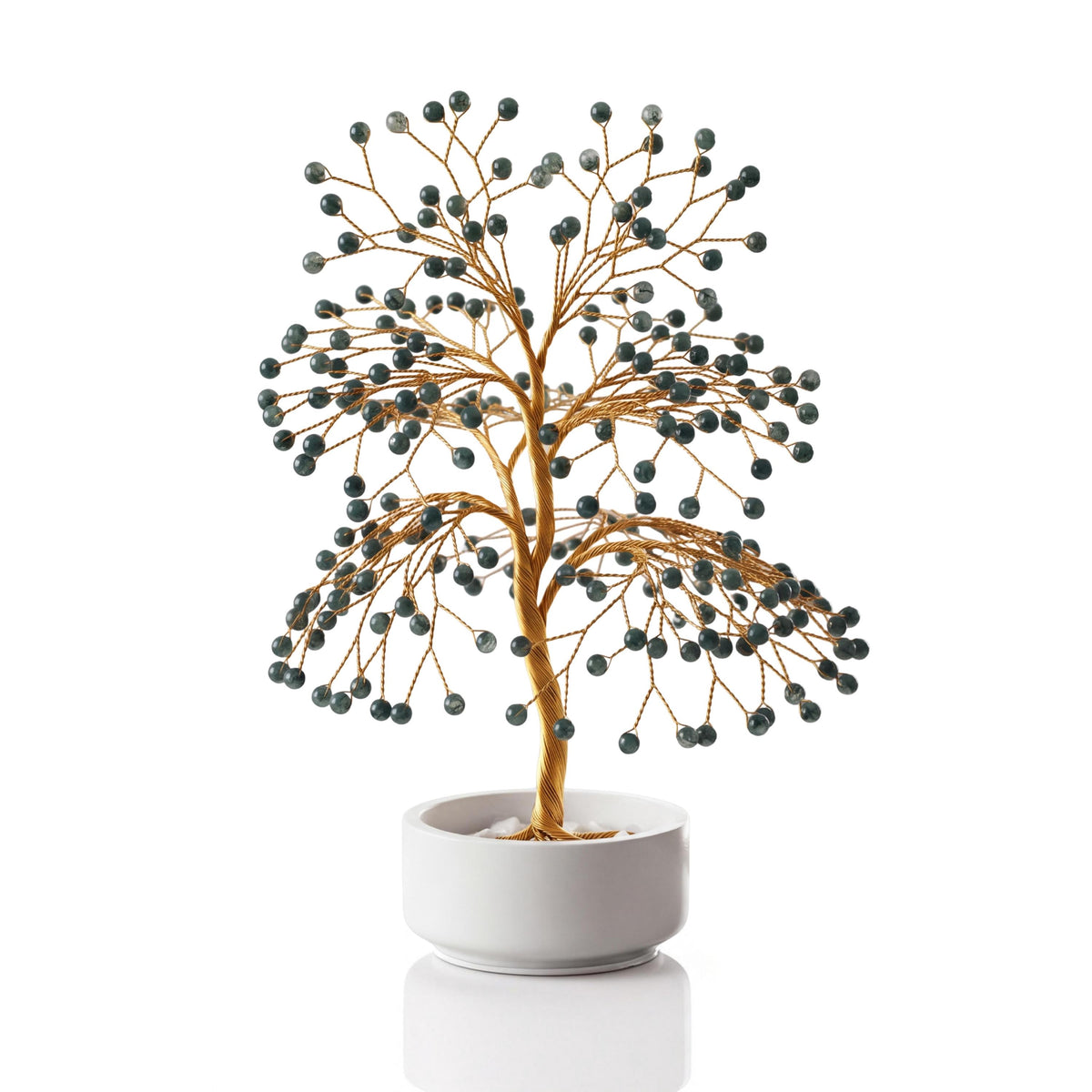 Gold-plated wire tree with polished forest green moss agate spheres in a white ceramic bowl