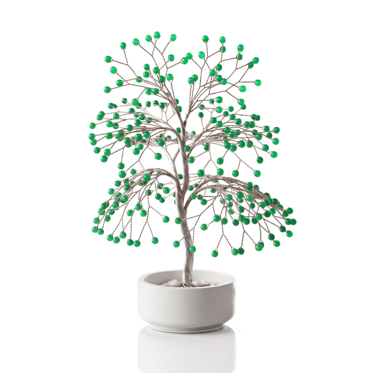 Silver-plated wire tree with polished fresh green aventurine spheres in a white ceramic bowl