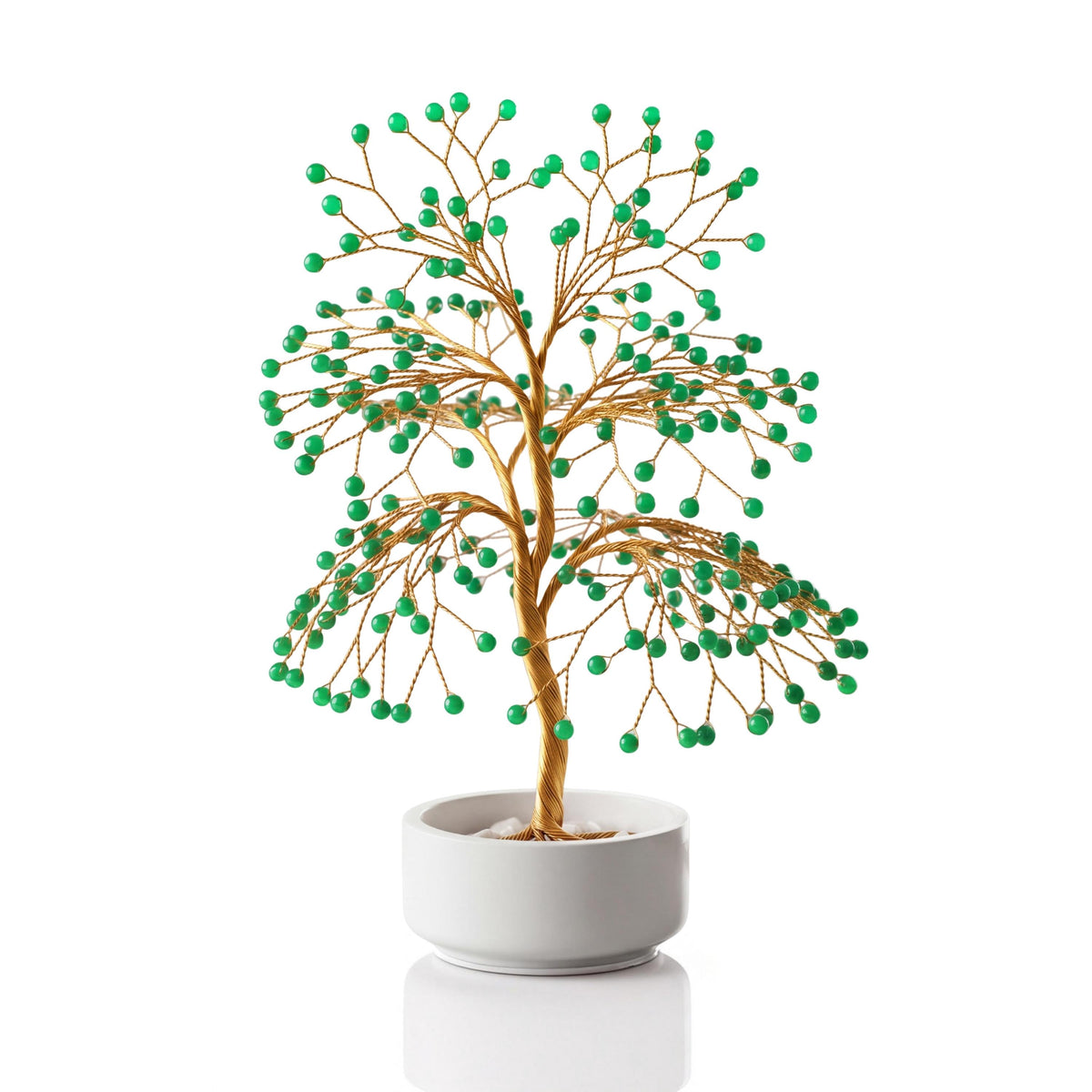 Gold-plated wire tree with polished fresh green aventurine spheres in a white ceramic bowl