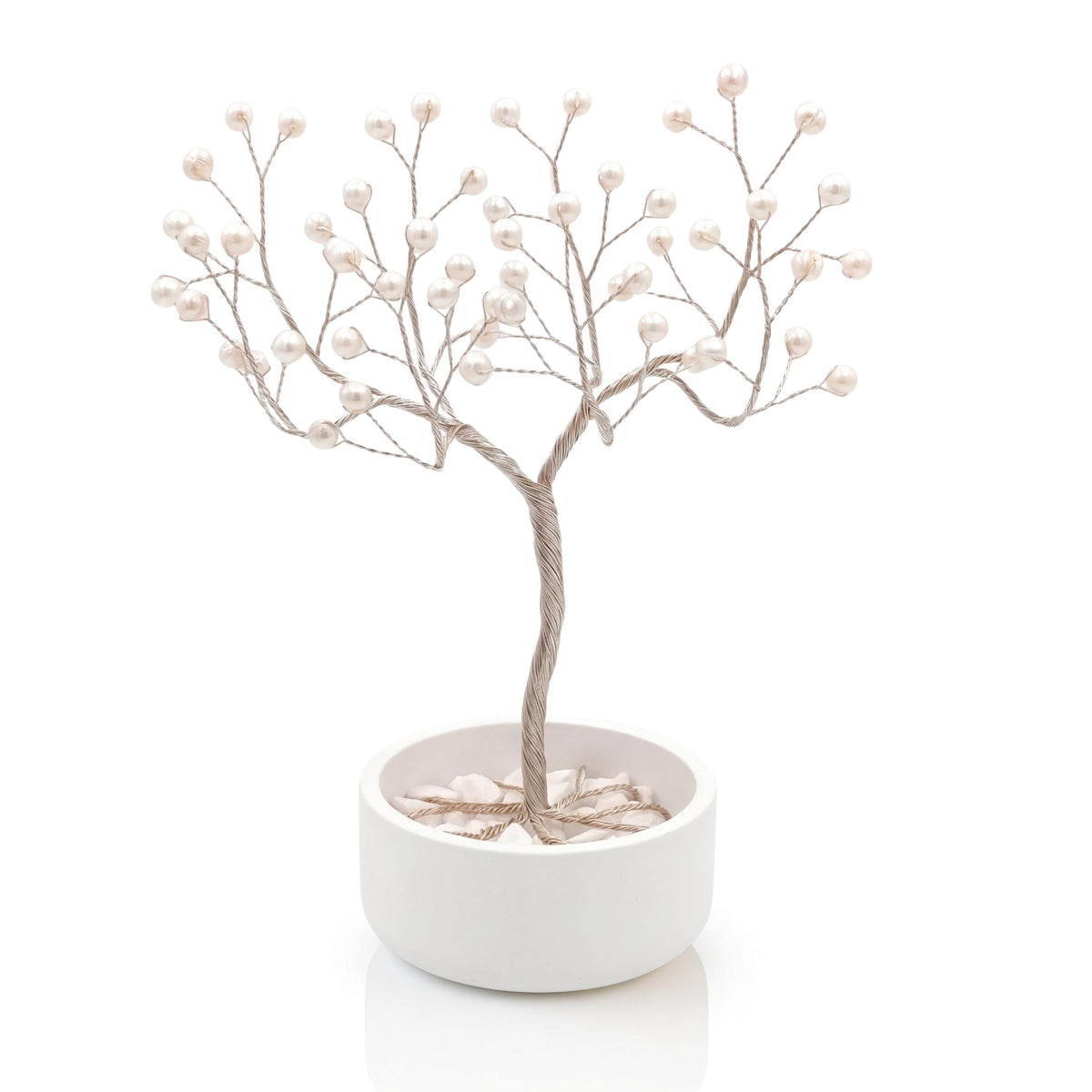 Handmade silver wire pearl tree with white freshwater pearls in a plain white ceramic bowl