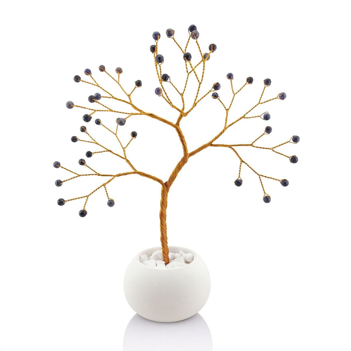 Gold-plated wire tree with dark navy faceted sapphire beads in a white ceramic bowl with printed anniversary text