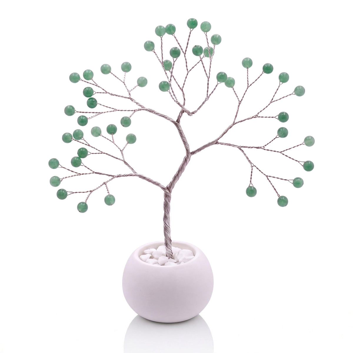 Silver-plated wire tree with polished sage green aventurine beads in a white bowl with white pebbles