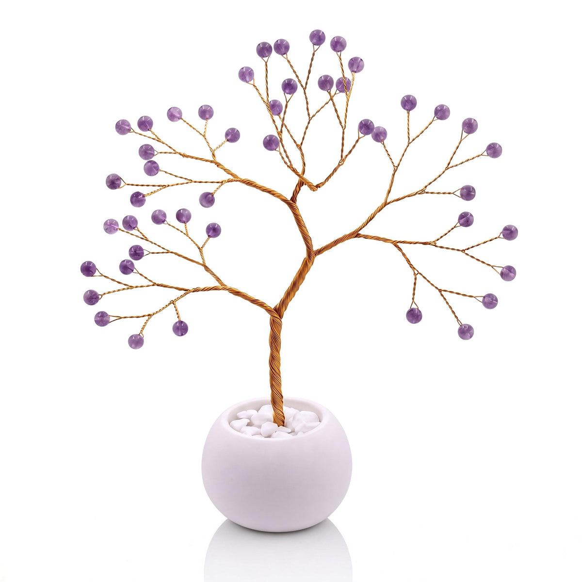 Gold-plated wire tree with polished grape purple amethyst beads in a white bowl with white pebbles