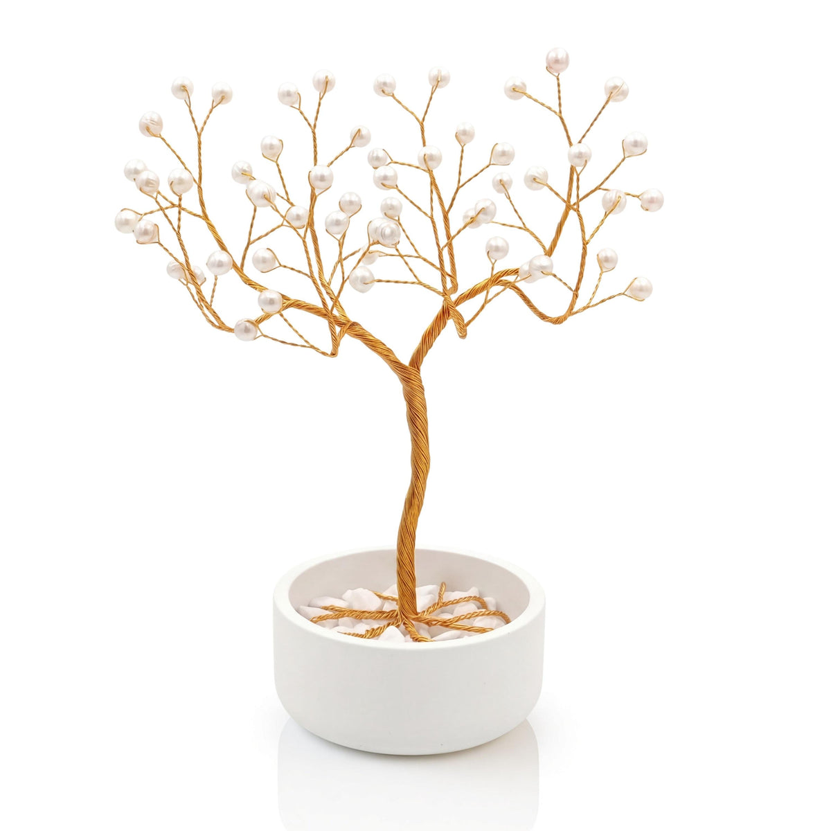 Handmade gold wire pearl tree with white freshwater pearls in a plain white ceramic bowl
