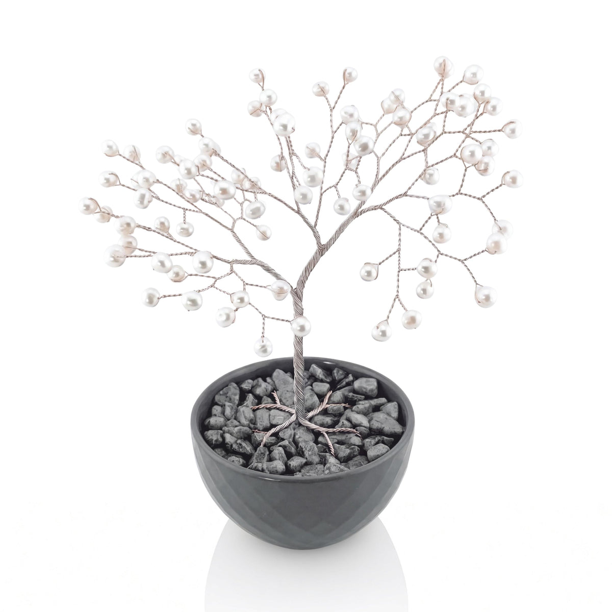 Silver wire tree of life with white freshwater pearls in a grey bowl with grey stones