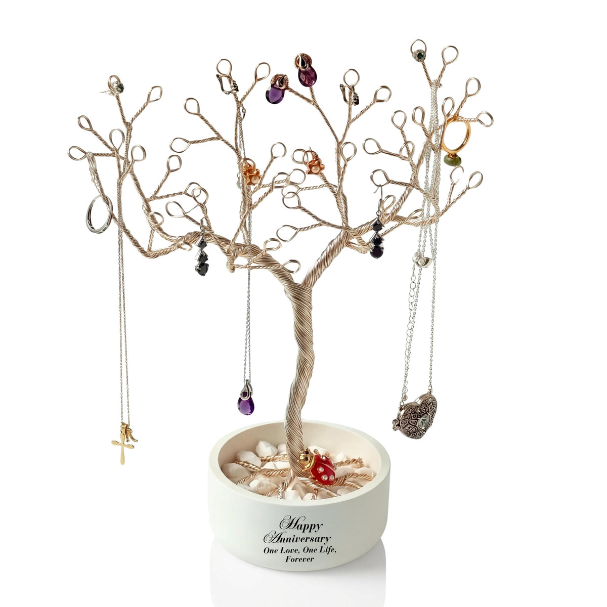 Handmade silver wire jewelry tree in a white anniversary bowl, hung with colored stones
