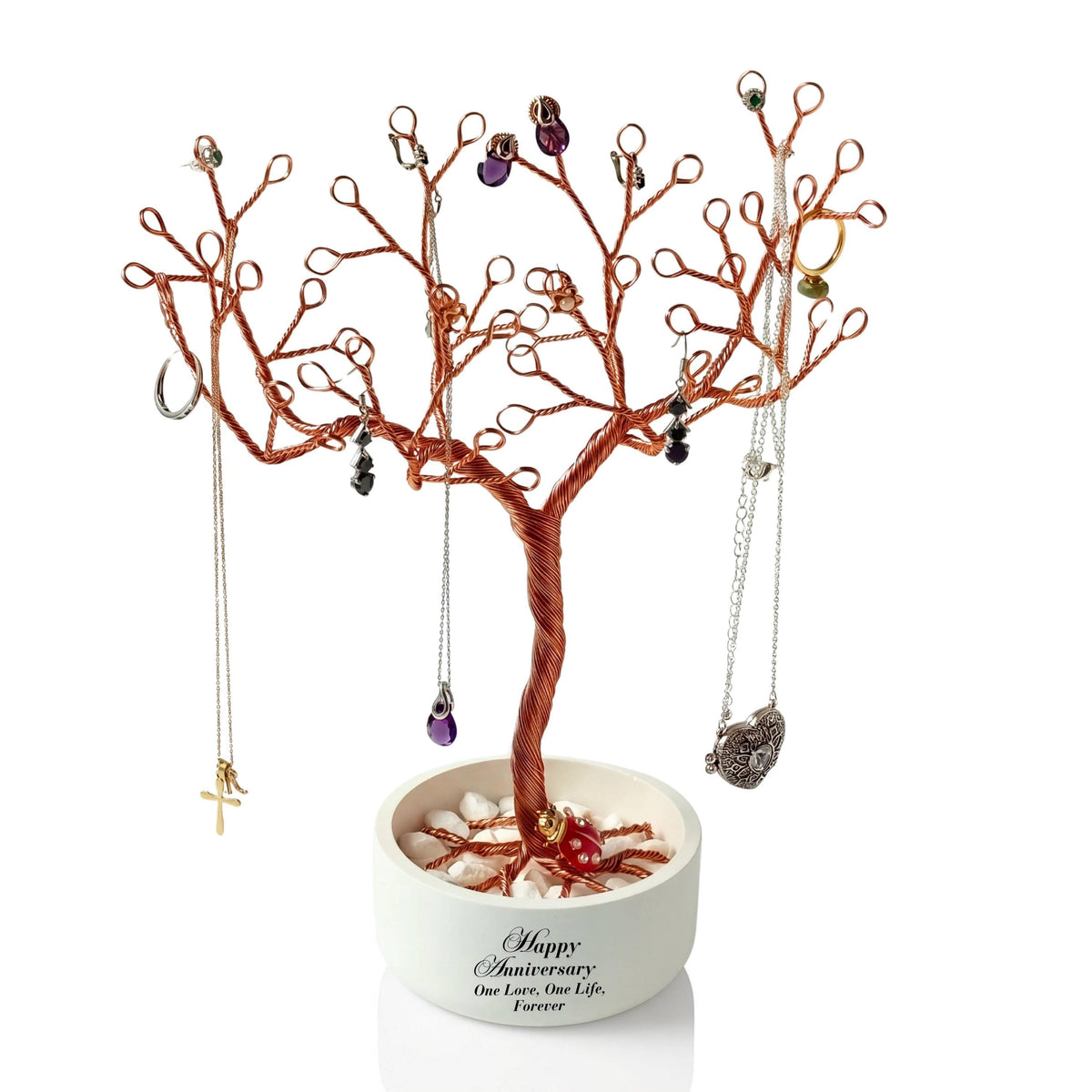 Handmade copper wire jewelry holder in a white anniversary bowl with jewelry hanging