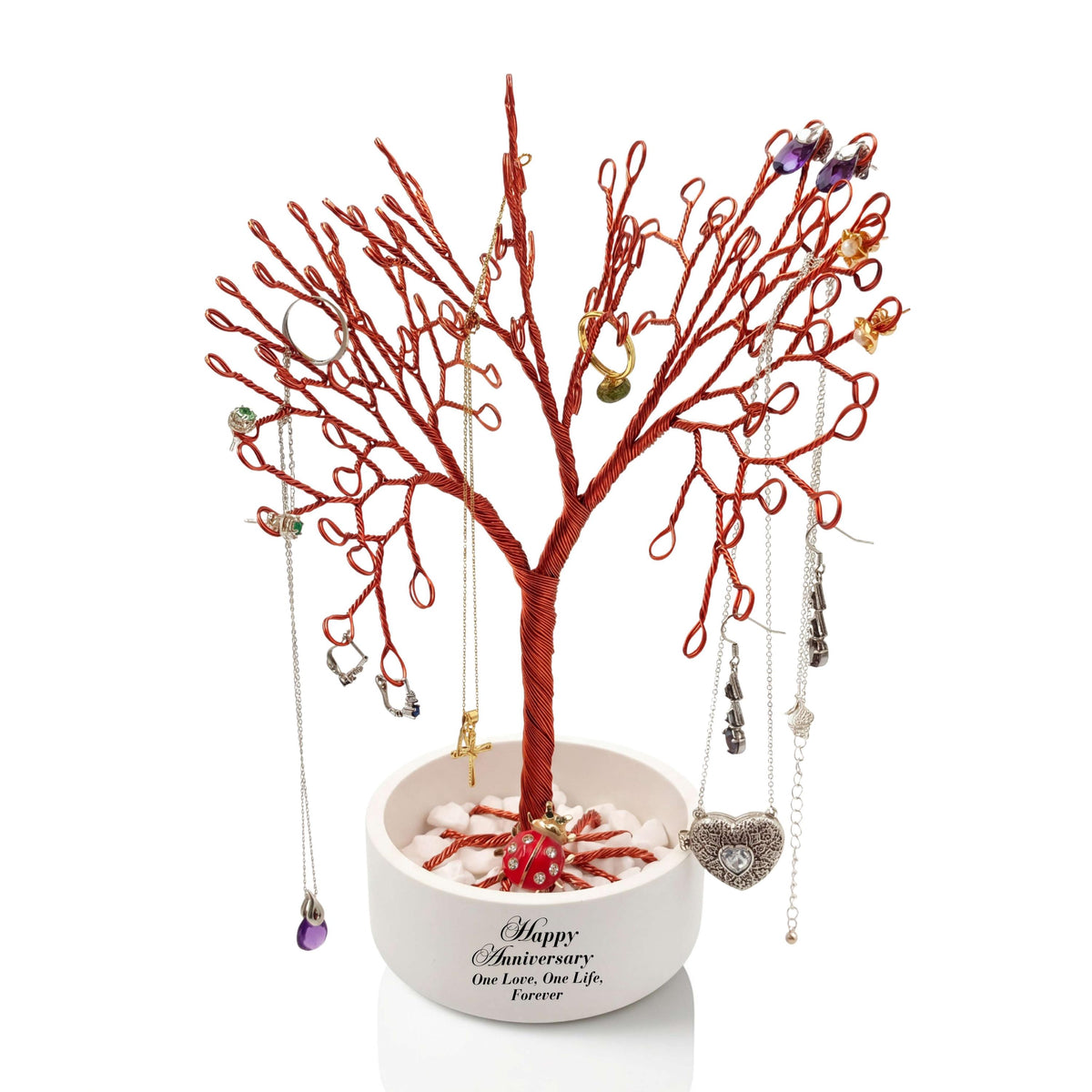 Personalized copper jewelry tree in a white anniversary bowl with necklaces and a heart pendant