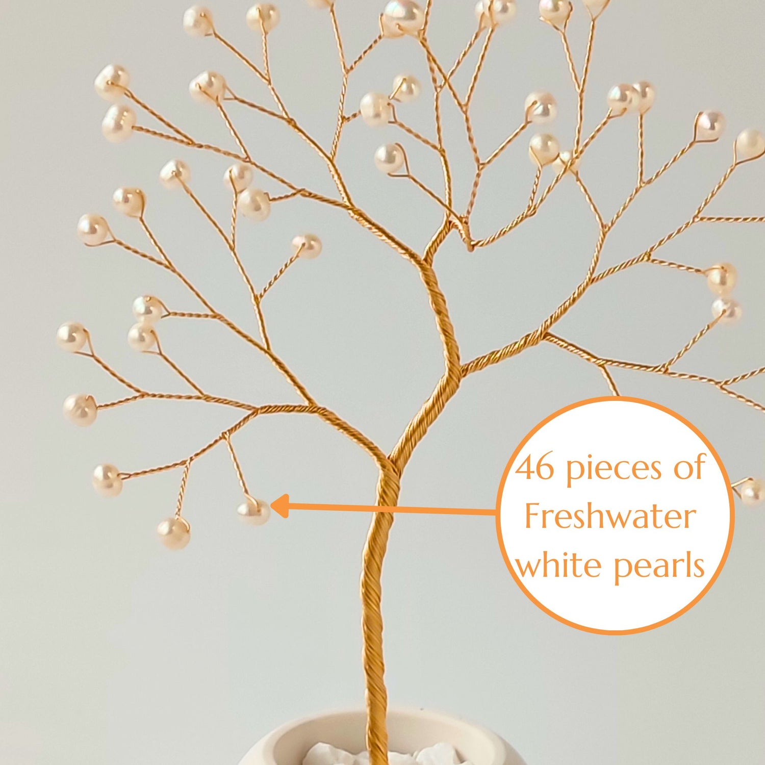 Close-up of gold wire branch with 46 natural freshwater pearls – elegant detail