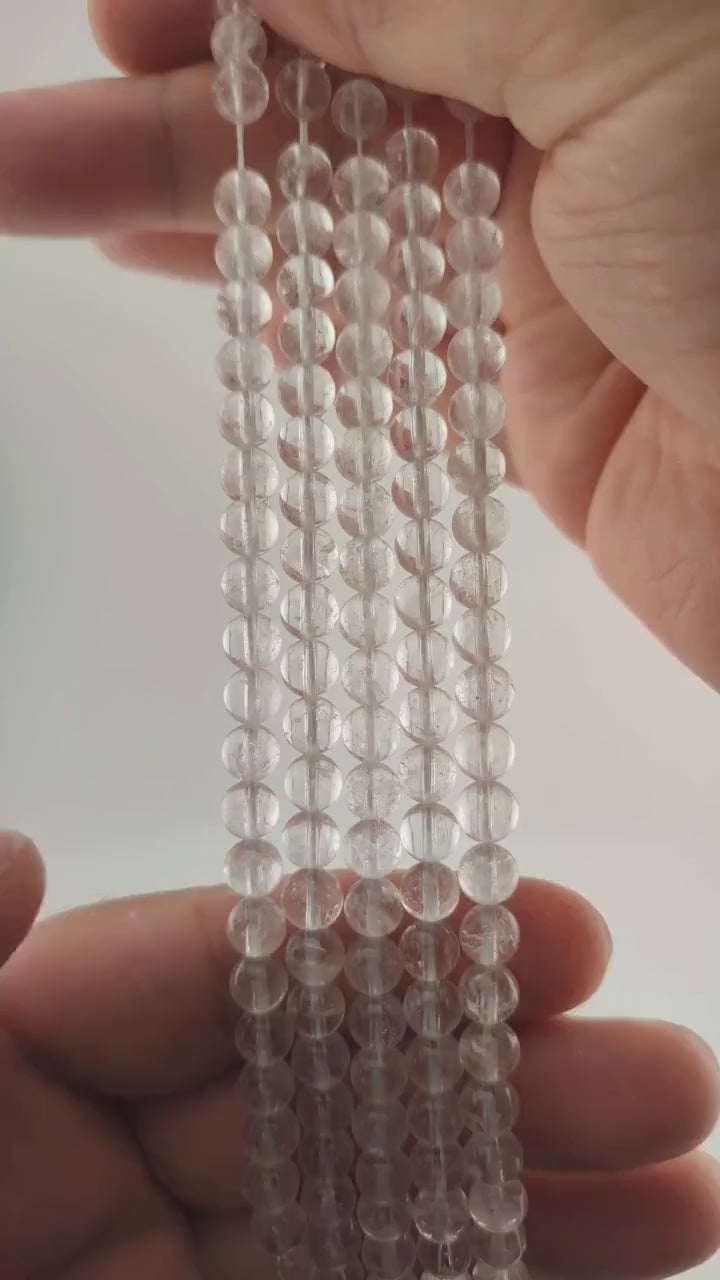 Video of strands of clear quartz beads used for this tree, held in the hand
