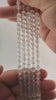 Video of strands of clear quartz beads used for this tree, held in the hand