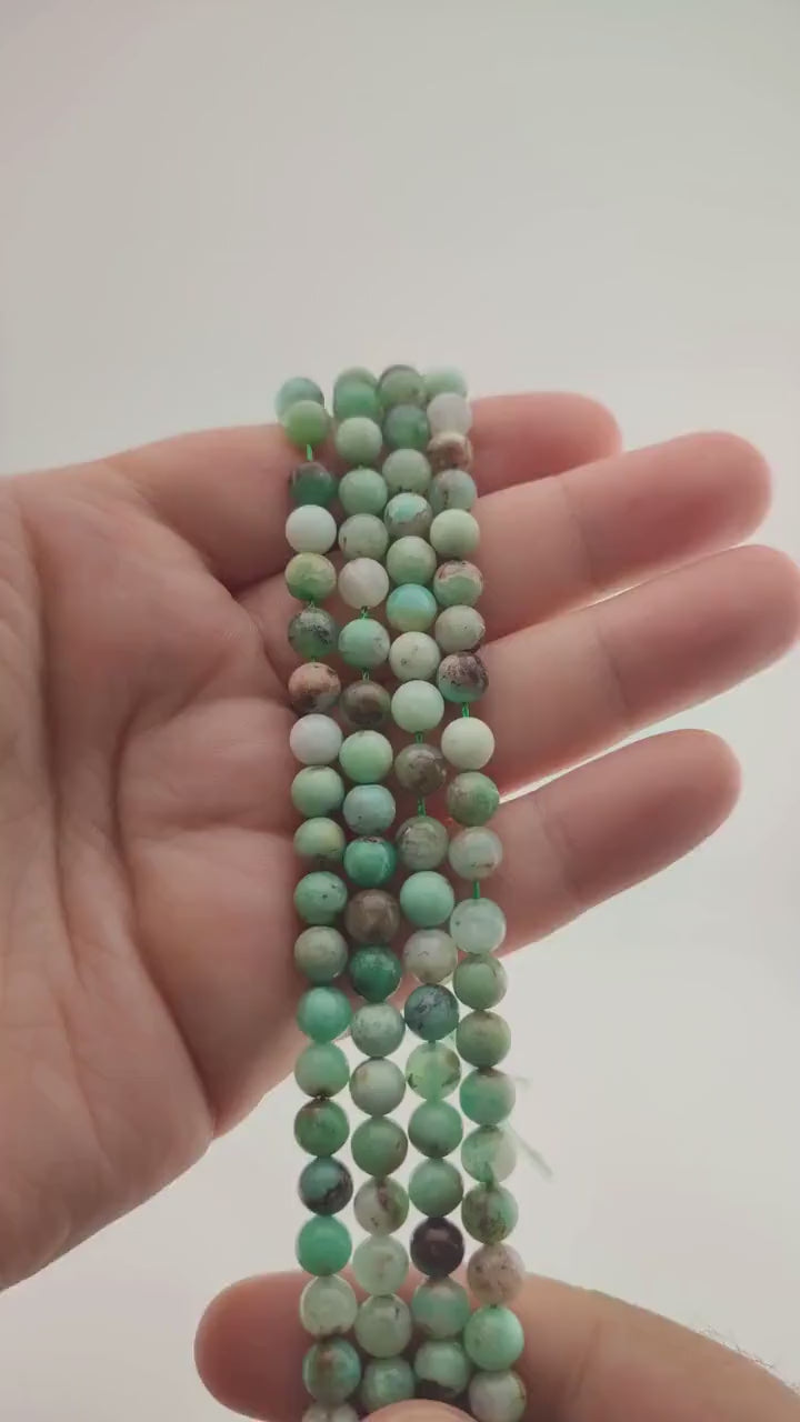 Video of strands of apple green chrysoprase beads used for this tree, held in the hand