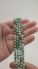 Video of strands of apple green chrysoprase beads used for this tree, held in the hand