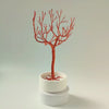 360° video of handmade copper jewelry tree with ceramic bowl and decorative white stones