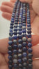 Video of strands of deep royal blue sodalite spheres used for this tree, held in the hand