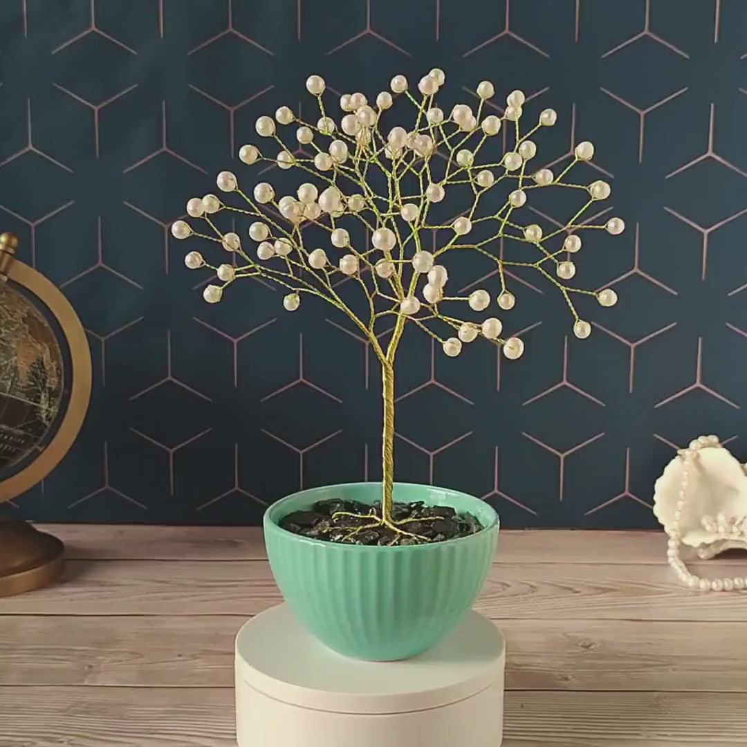 Video of the handmade gold pearl Tree of Life in a turquoise ceramic bowl
