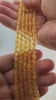Video of strands of golden yellow citrine spheres used for this tree, held in the hand