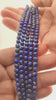 Video of strands of deep blue lapis lazuli beads used for this tree, held in the hand