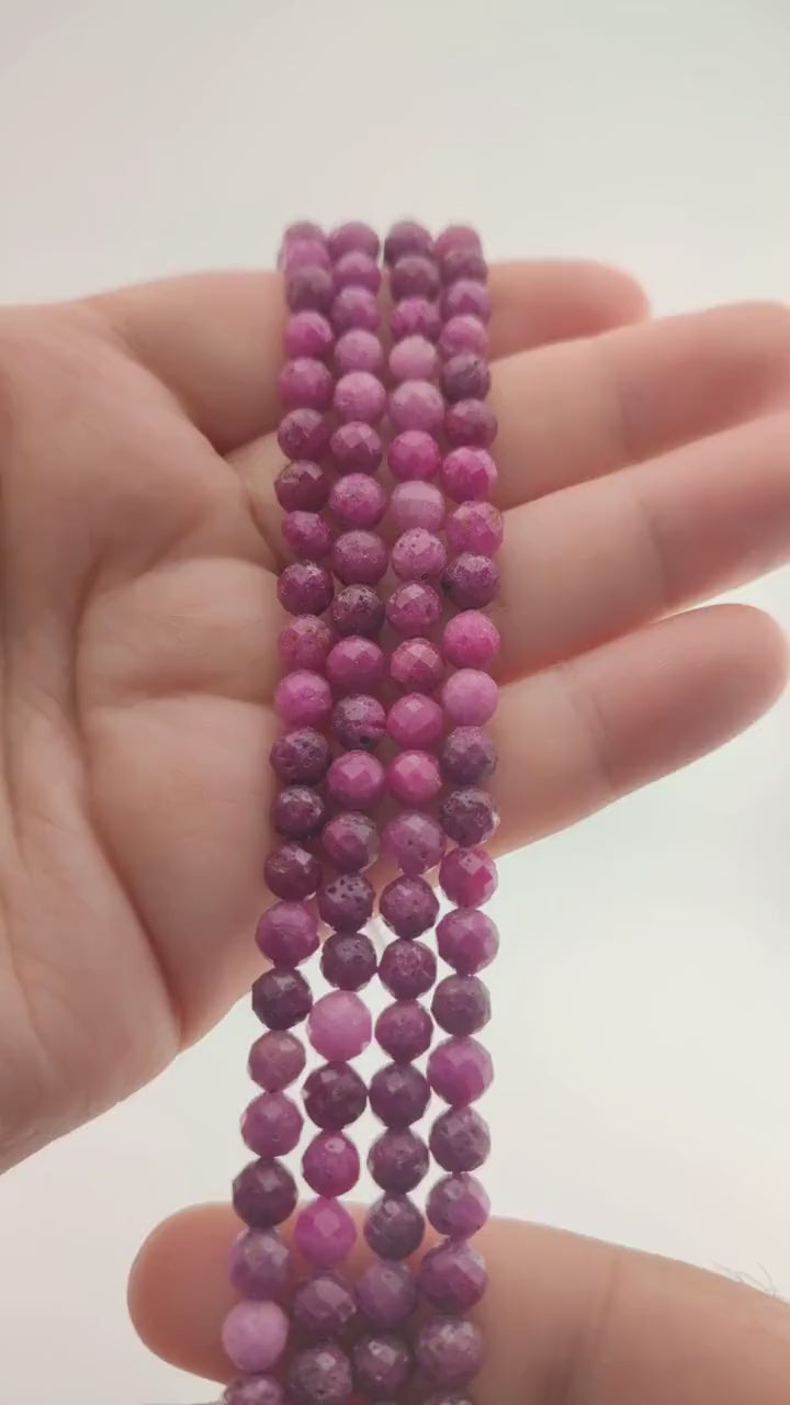 Video of strands of ruby beads used for this tree, held in the hand