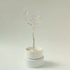 360° video of handmade silver jewelry tree with ceramic bowl and decorative white stones