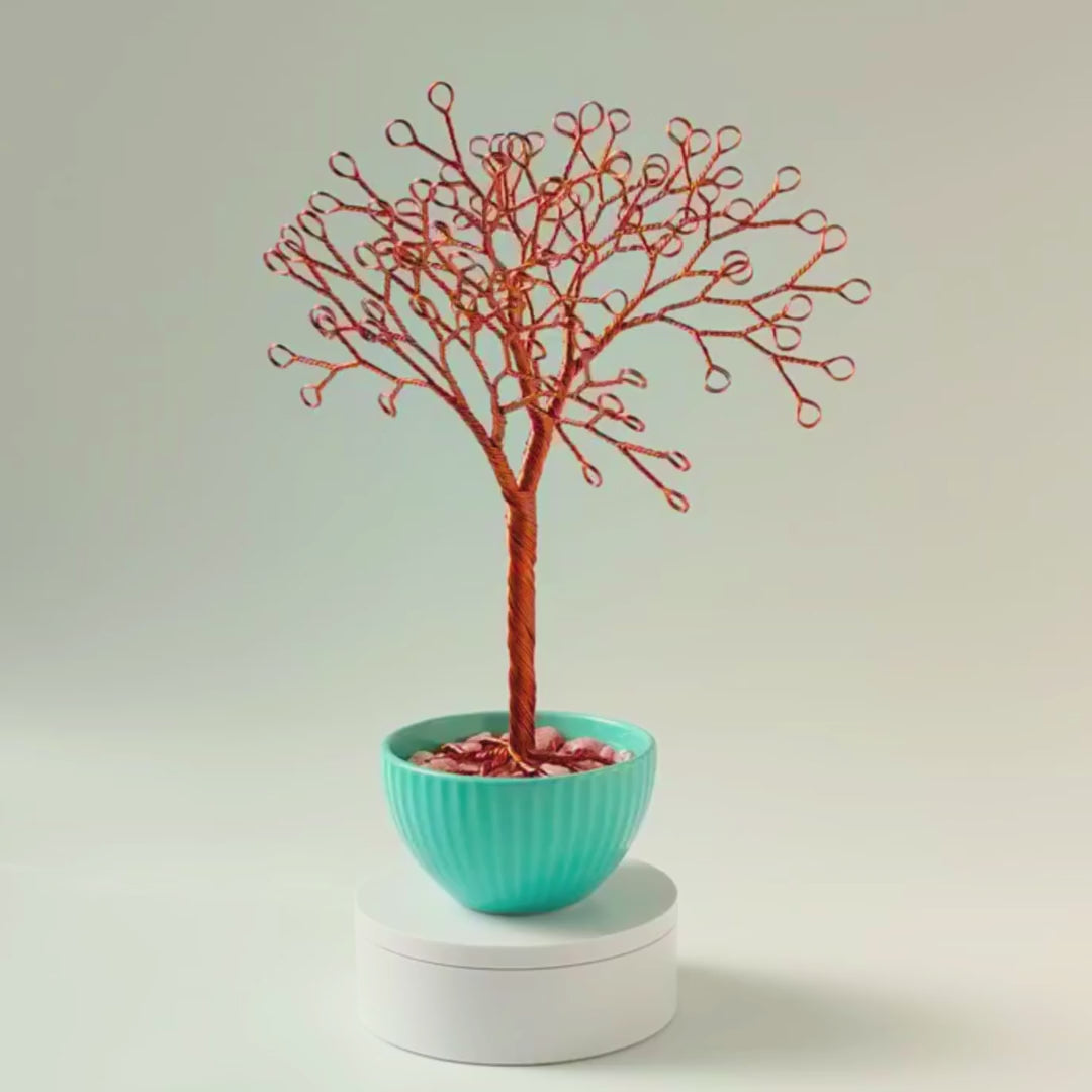 360° video of handmade copper jewelry tree with tuquoise ceramic bowl and decorative pink stones