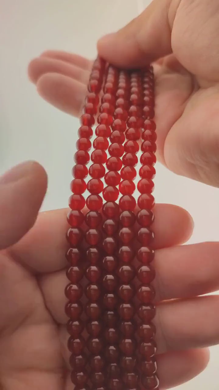Video of strands of cherry red carnelian beads used for this tree, held in the hand