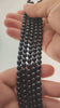 Video of strands of glossy black obsidian beads used for this tree, held in the hand