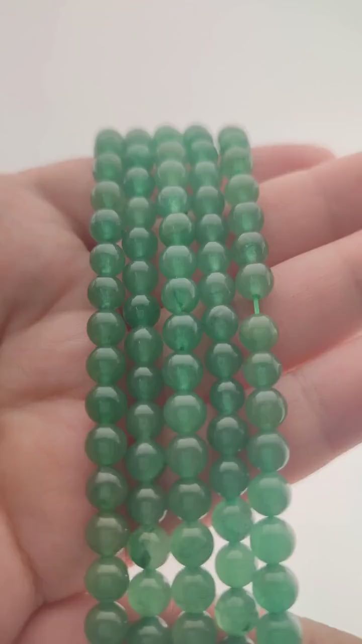 Video of strands of fresh green aventurine spheres used for this tree, held in the hand