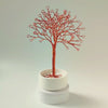 360° video of personalized copper jewelry tree in a white bowl with white stones