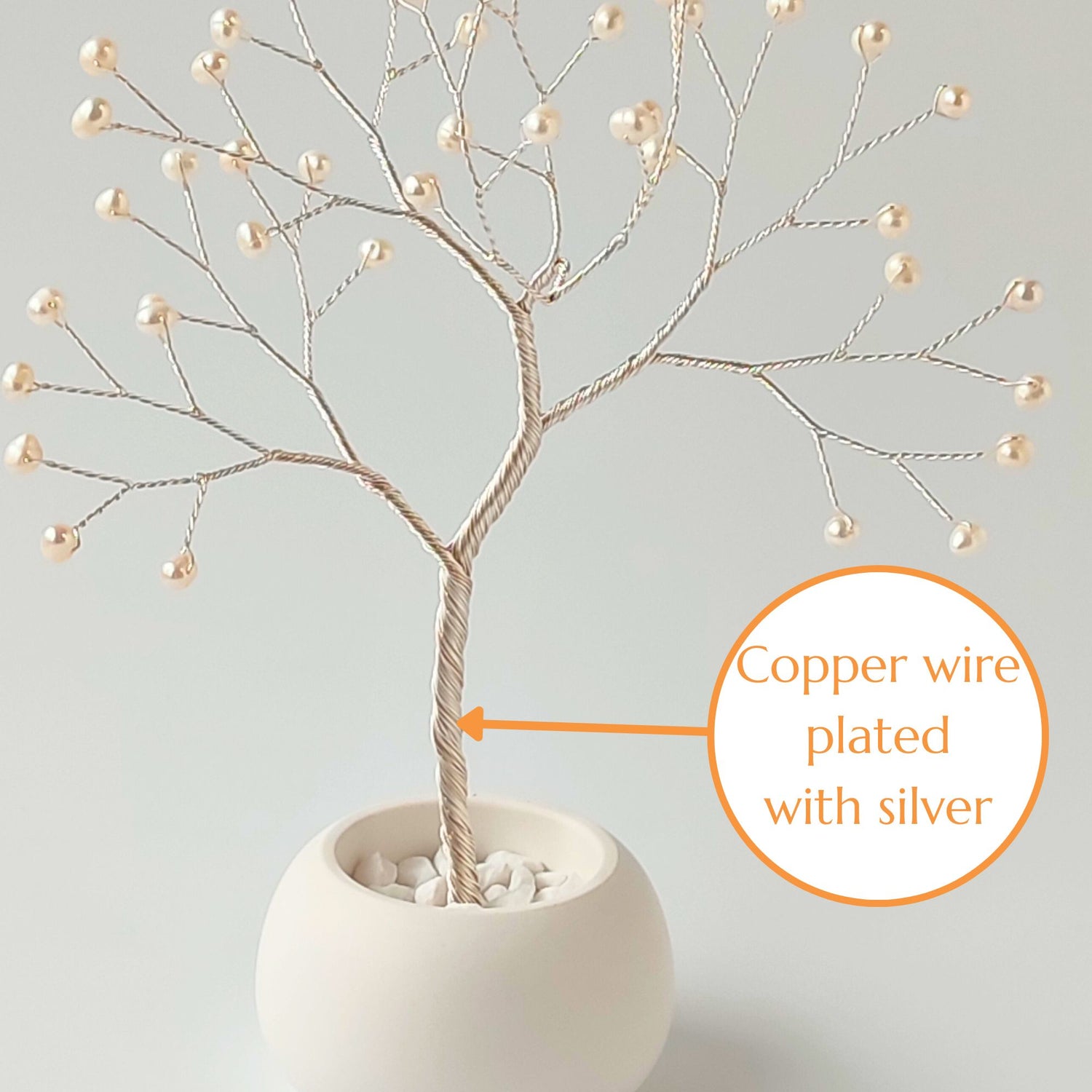 Strong silver plated wire trunk of handmade pearl jewelry small tree – close-up detail