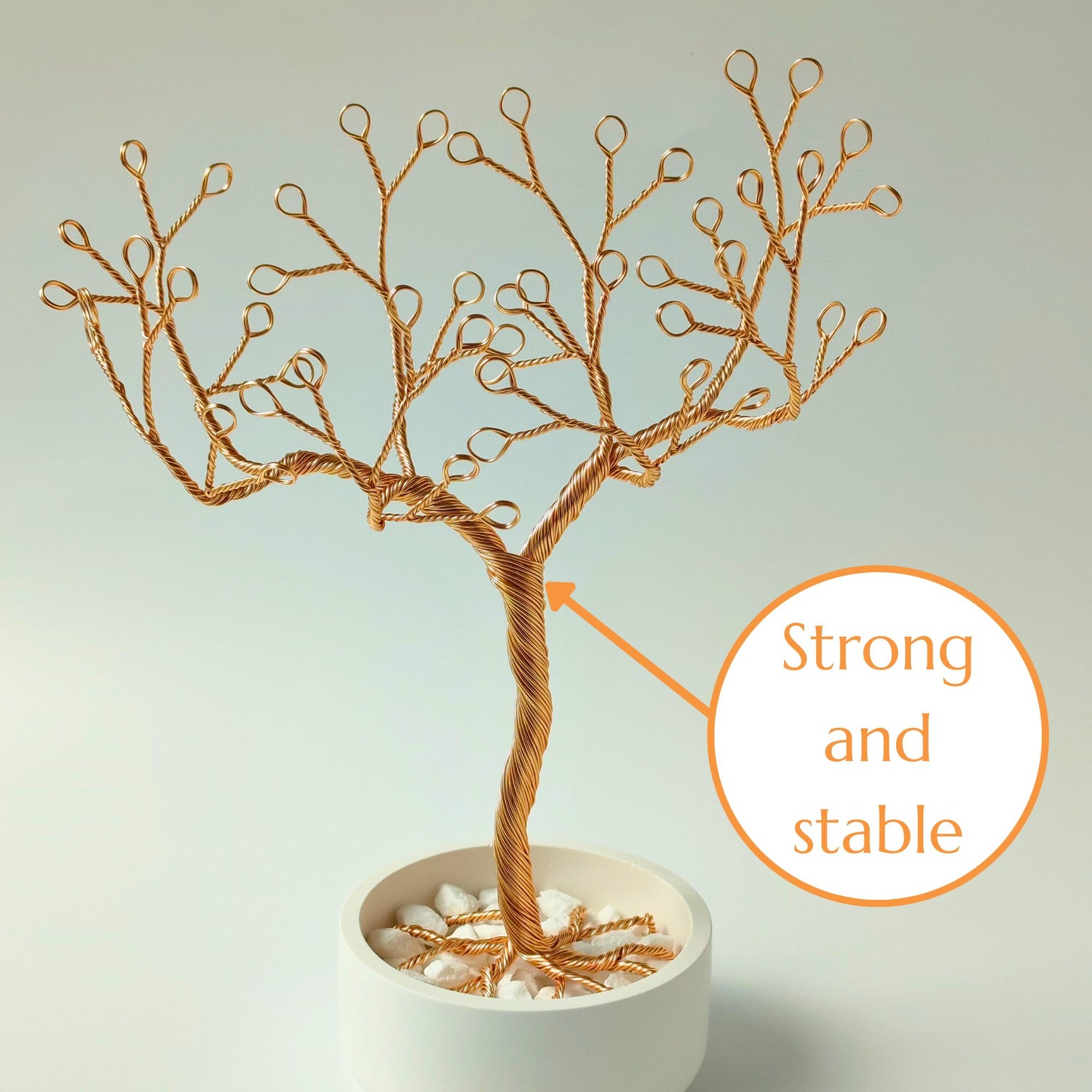 Gold jewelry holder with strong and stable wire trunk and decorative stones