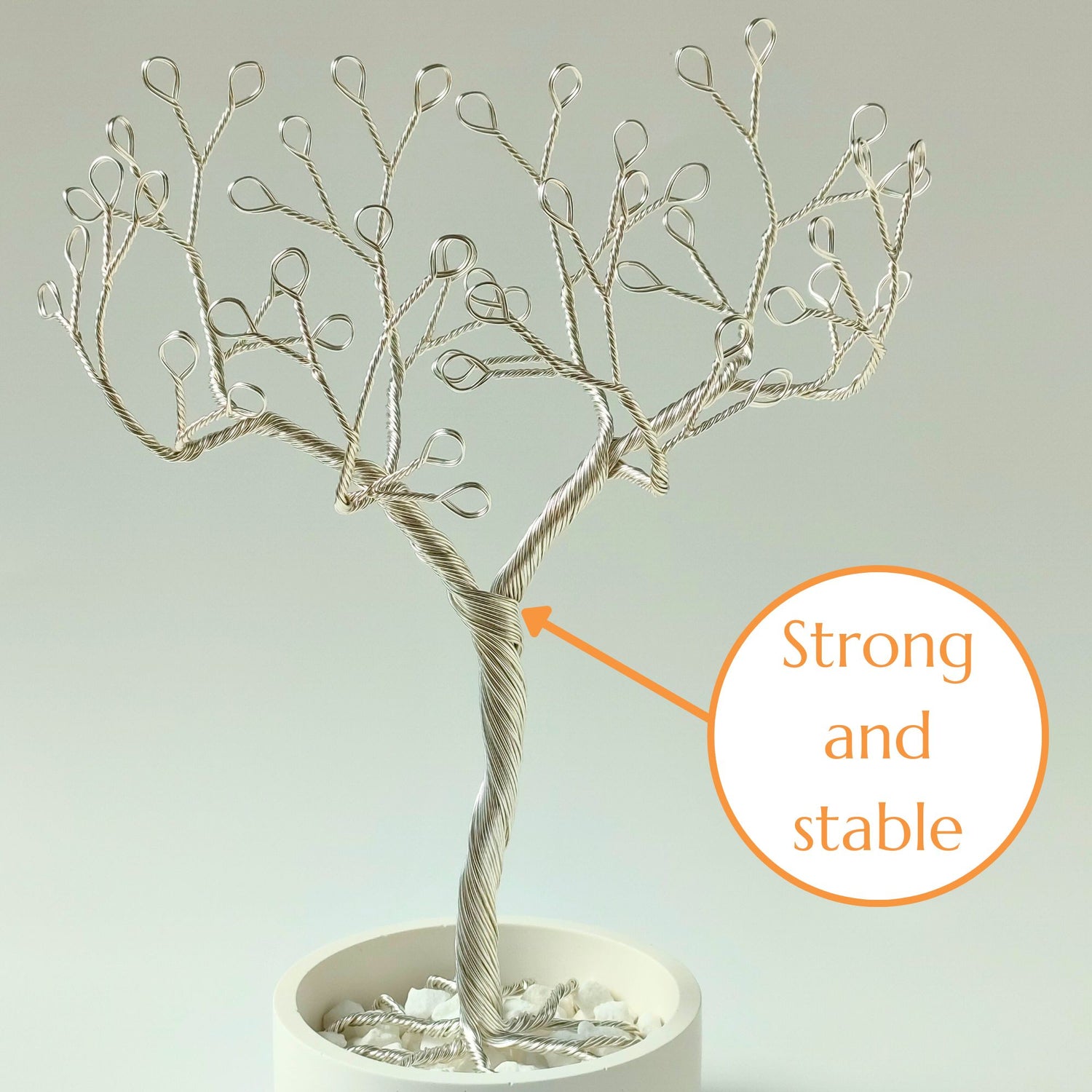 Silver jewelry holder with strong and stable wire trunk and decorative stones